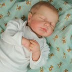 Lalka Reborn LouLou śpiące niemowlę z miękkim materiałowym korpusem