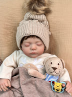 Lalka Reborn 48 cm – śpiące niemowlę z miękkim materiałowym korpusem